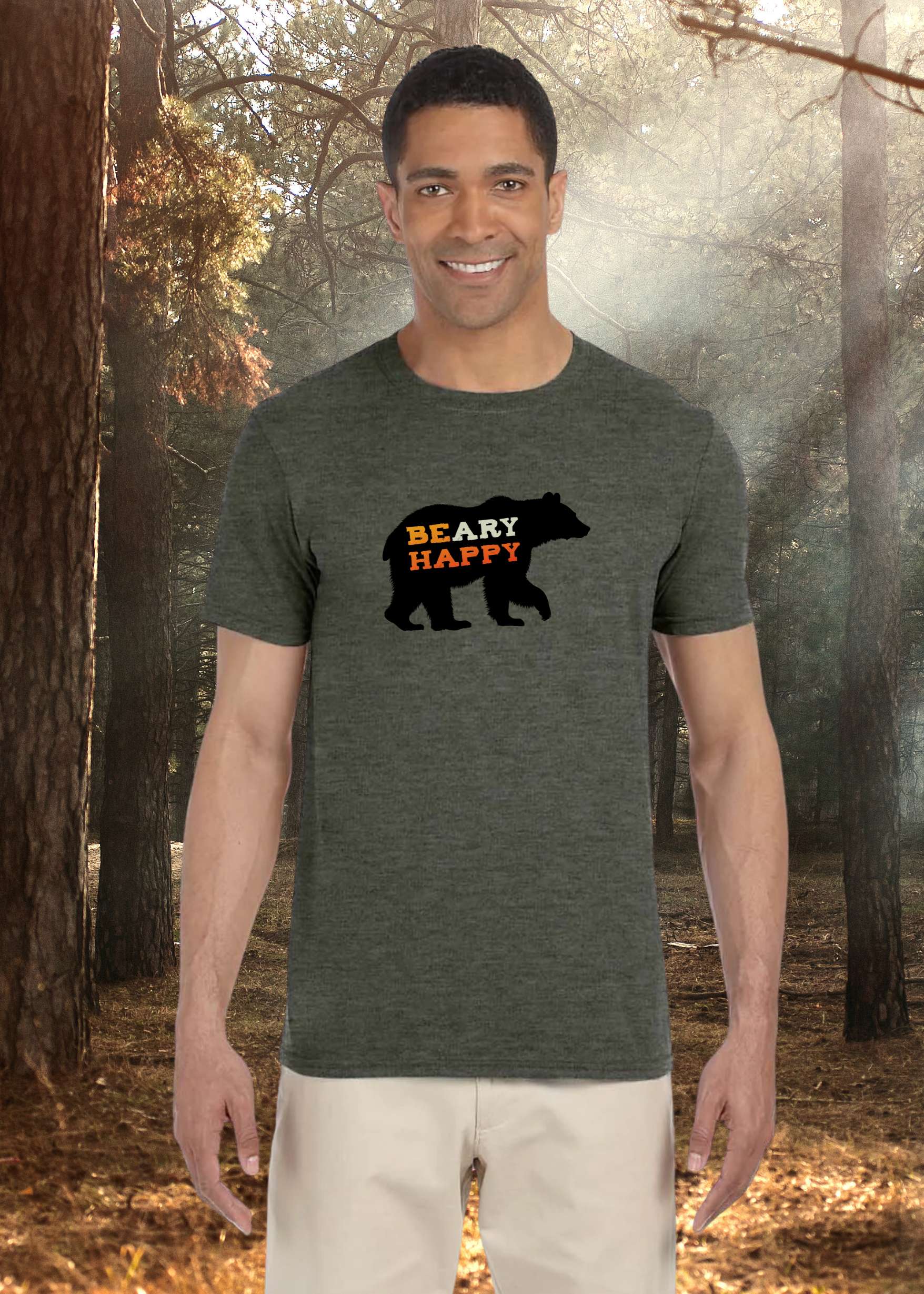 Man wearing a gray t-shirt with a bear graphic and 'BEAR HAPPY' text in a forest setting
