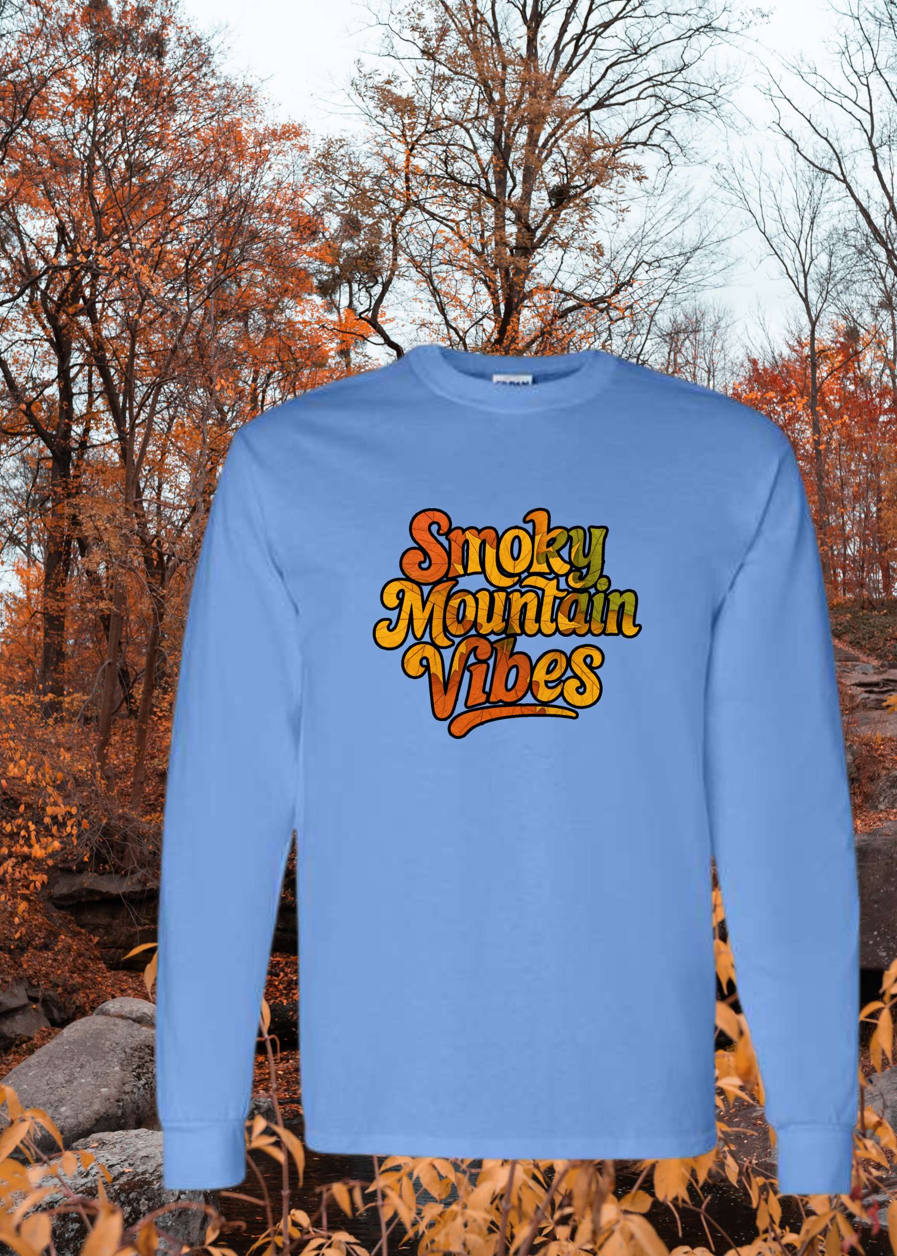 Blue sweatshirt with 'Smoky Mountain Vibes' text in an autumn setting