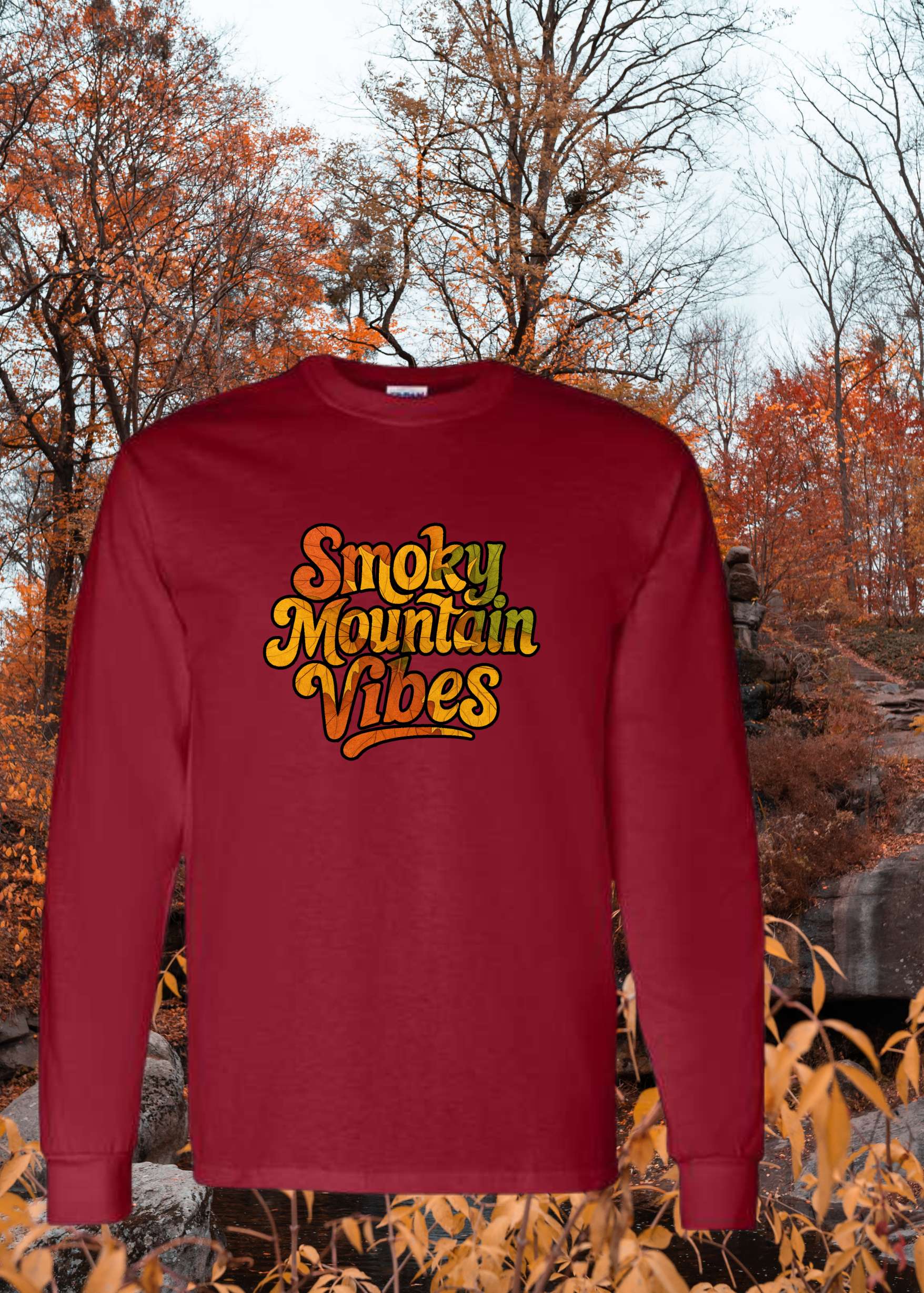 Red sweatshirt with 'Smoky Mountain Vibes' text against a scenic background with trees and water.